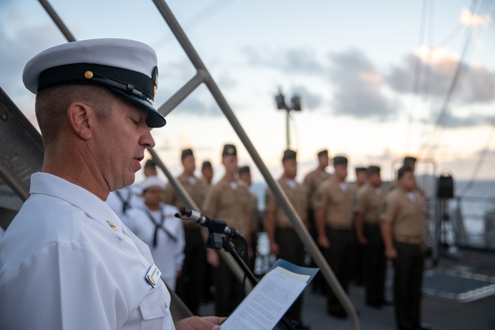 U.S. Marines, Sailors aboard USS Pearl Harbor honor fallen Sailor with memorial