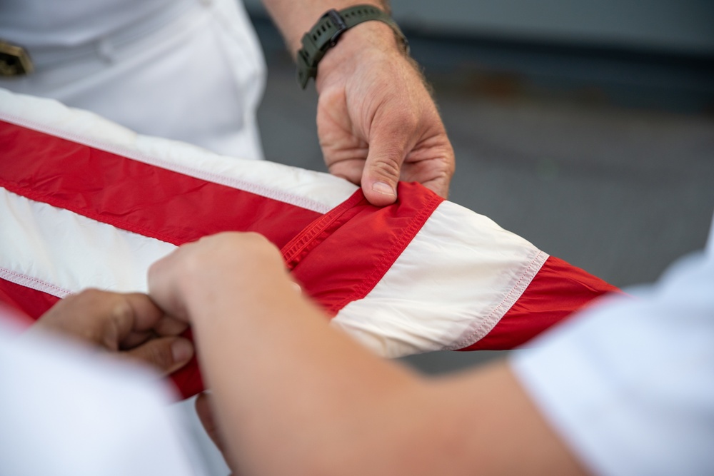 U.S. Marines, Sailors aboard USS Pearl Harbor honor fallen Sailor with memorial