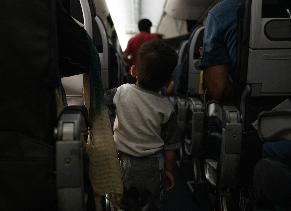 Evacuees from Afghanistan prepare to board