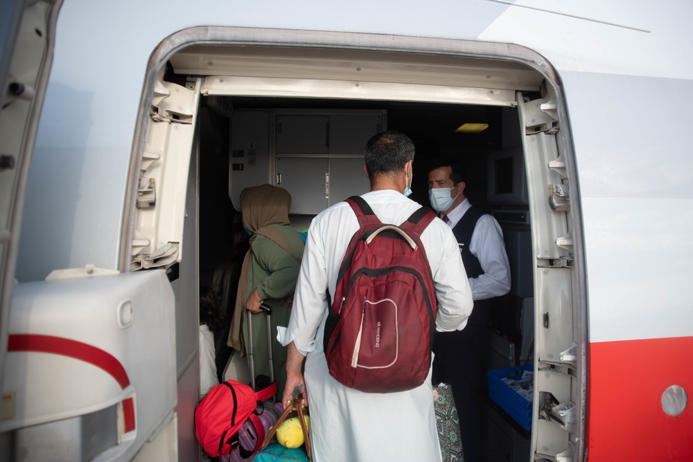 Evacuees from Afghanistan prepare to board