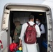 Evacuees from Afghanistan prepare to board