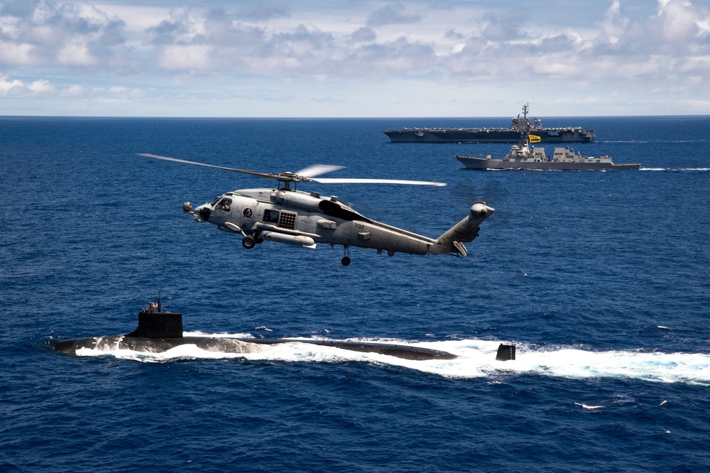 Sea Hawk flies over USS Carl Vinson and USS Seawolf