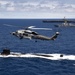 Sea Hawk flies over USS Carl Vinson and USS Seawolf
