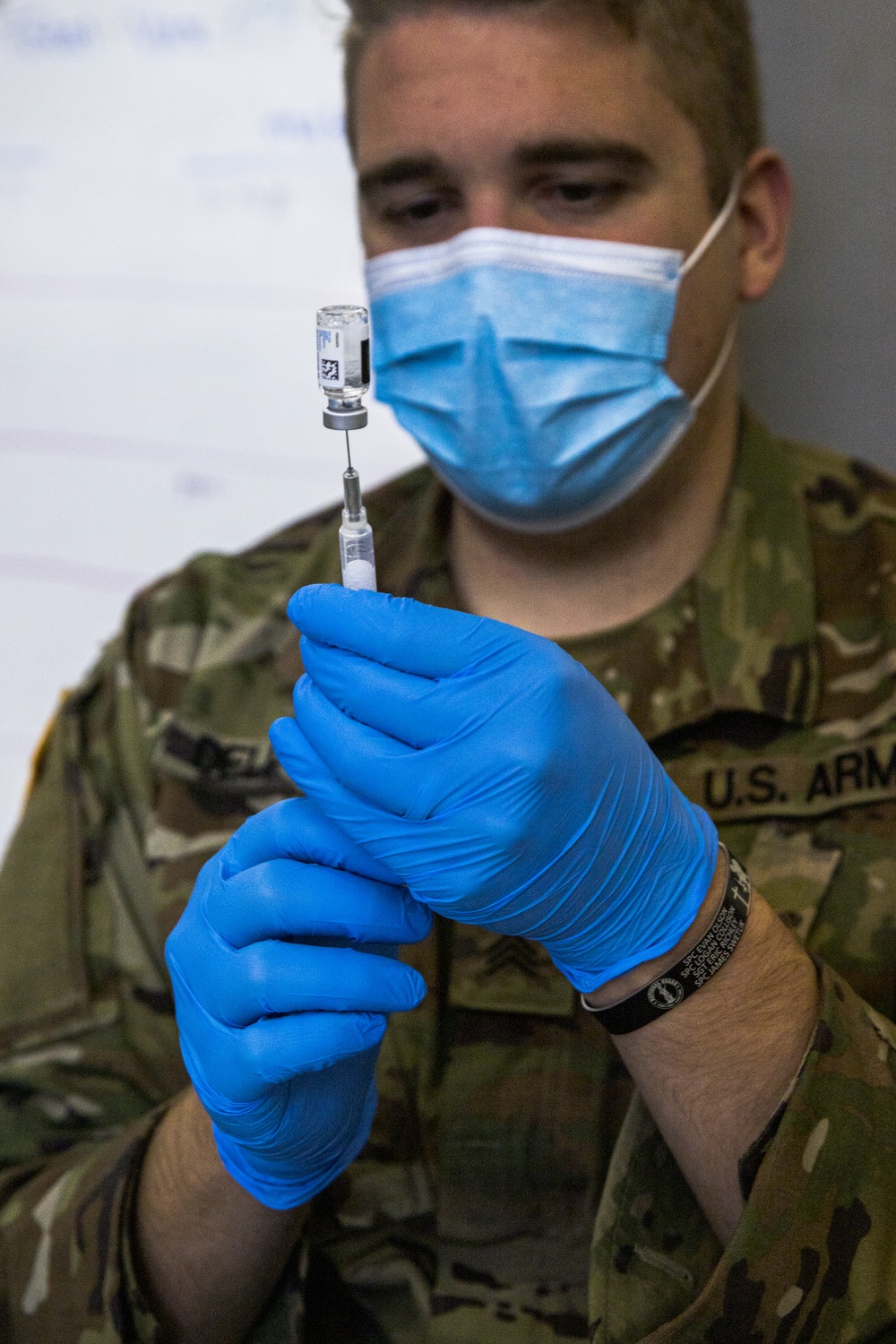 U.S. Soldier Draws Covid-19 Vaccine for Evacuees at Fort McCoy, Wisconsin