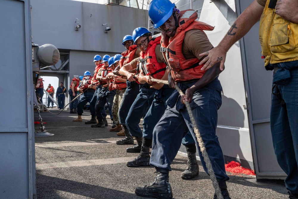 Sailors Heave a Line During a Replenishment-at-Sea