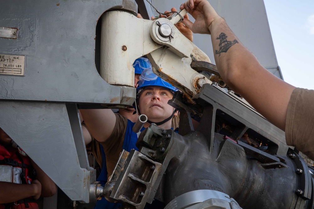 USS Arlington Sailor Secures the Span Wire During a Replenishment-at-Sea