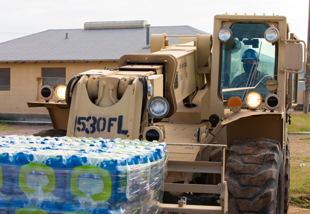 Soldiers deliver water to Afghan evacuees