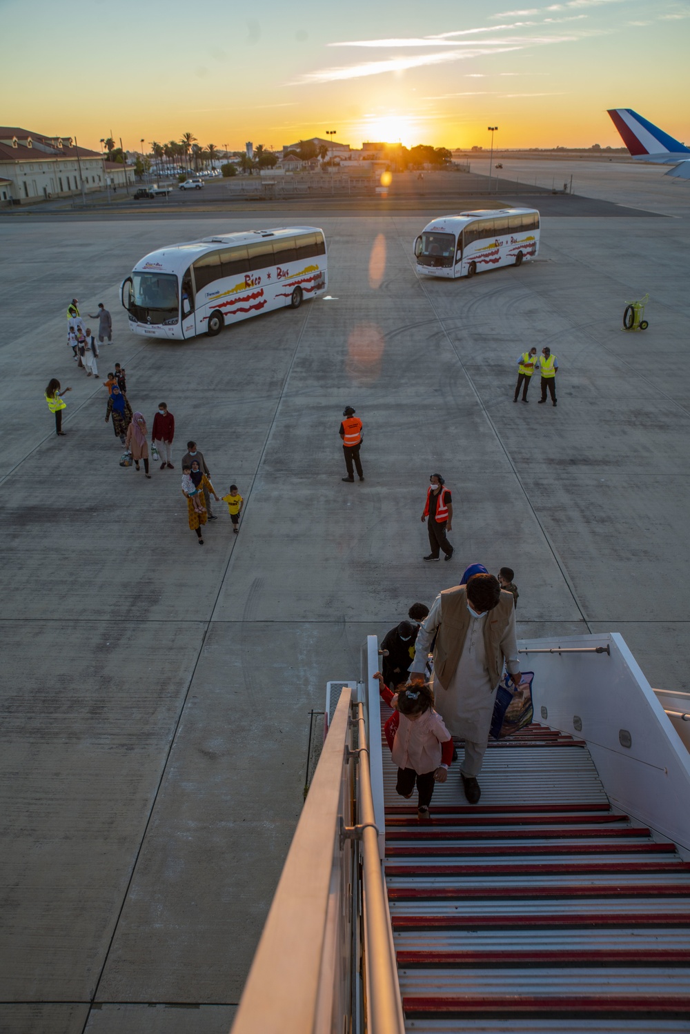 Evacuees depart NAVSTA Rota for the United States