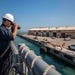 USS Billings Sailor Uses Range Finder During Sea and Anchor Detail