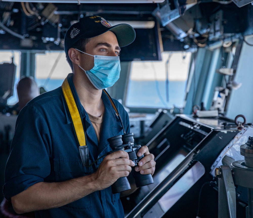 Ensign Nicholas Gutierrez stands Watch in the Pilot House aboard the USS Barry