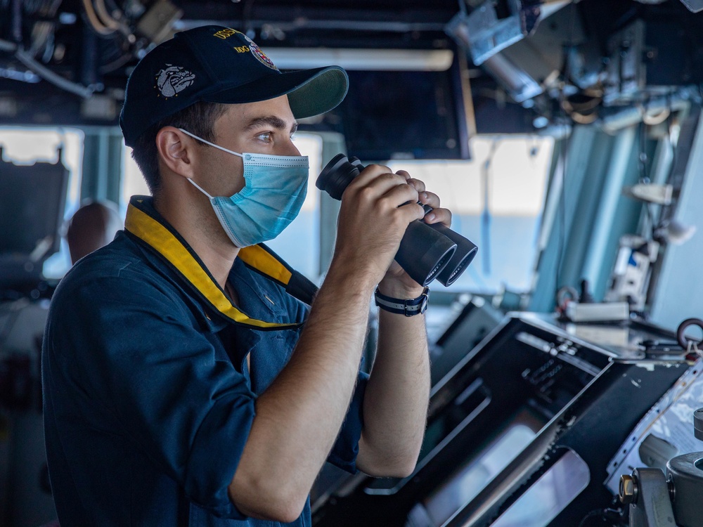 Ensign Nicholas Gutierrez stands Watch in the Pilot House aboard the USS Barry