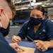 HM3 Zeltzin Soto and HM3 Bryce Davenport conduct Suture Training aboard the USS Barry