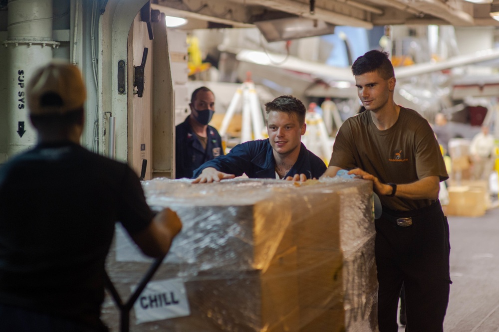 USS Carl Vinson (CVN 70) Sailors Move Supplies