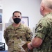 Fleet Master Chief James Honea speaks with Staff Sgt. Ryan Gulotta about the Basic Leader Course