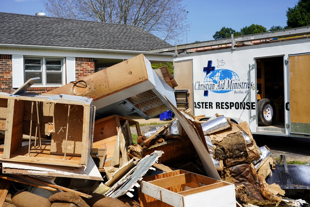 Debris Next to Christian Aid Ministries Trailer