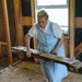 Christian Aid Ministries Volunteer Removing Debris