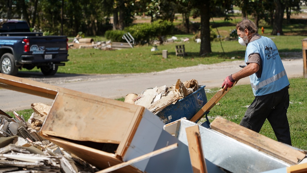 Volunteer Dumping Debris