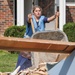 Dumping Debris in Front of Flooded House