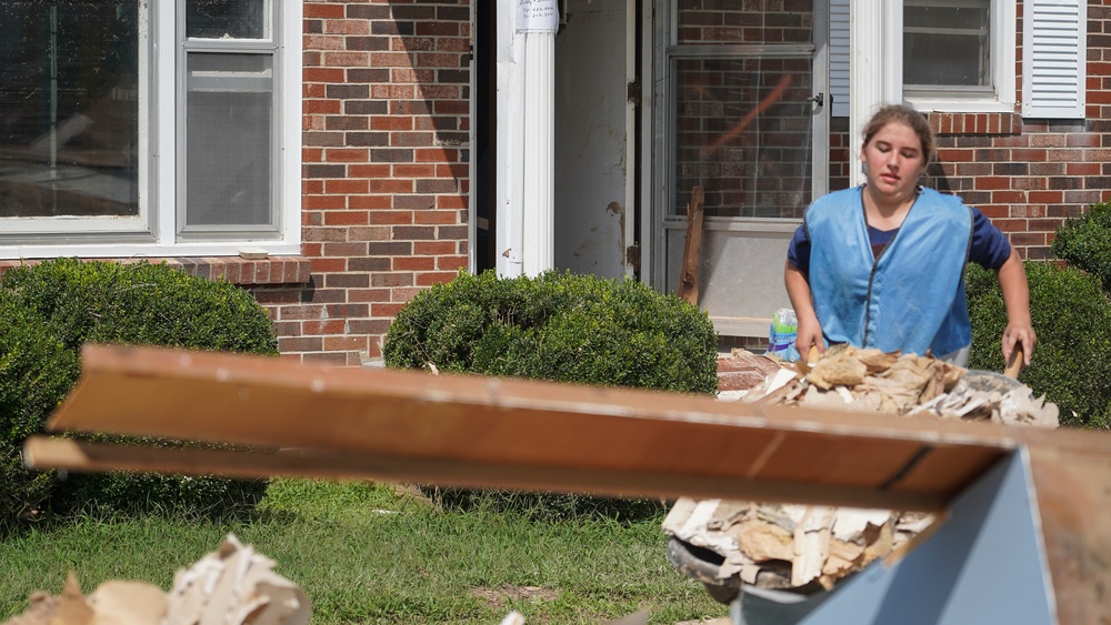 Removing Debris From House to Roadside