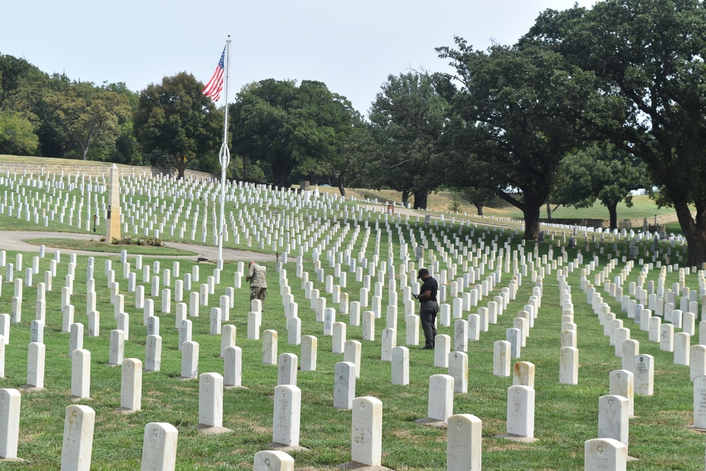 Office of Army Cemeteries representatives review headstones