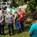 First Lady of Tennessee and Her Staff Pray at Flooded Site