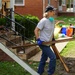 Volunteer Carrying Out Debris