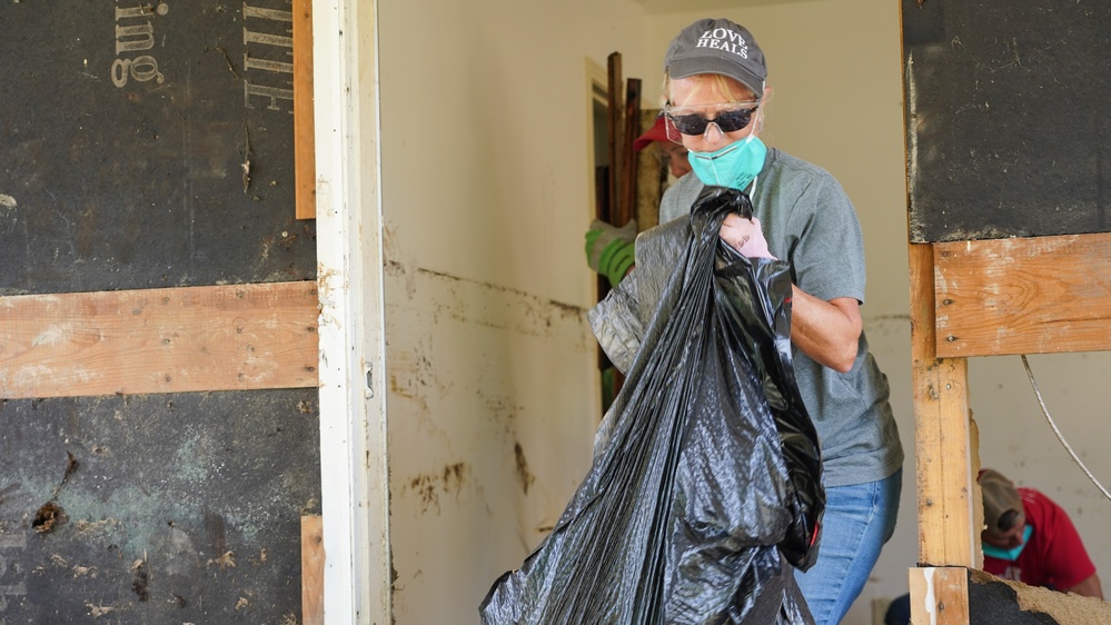 Volunteer Removes Debris in Waverly