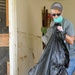 Volunteer Removes Debris in Waverly