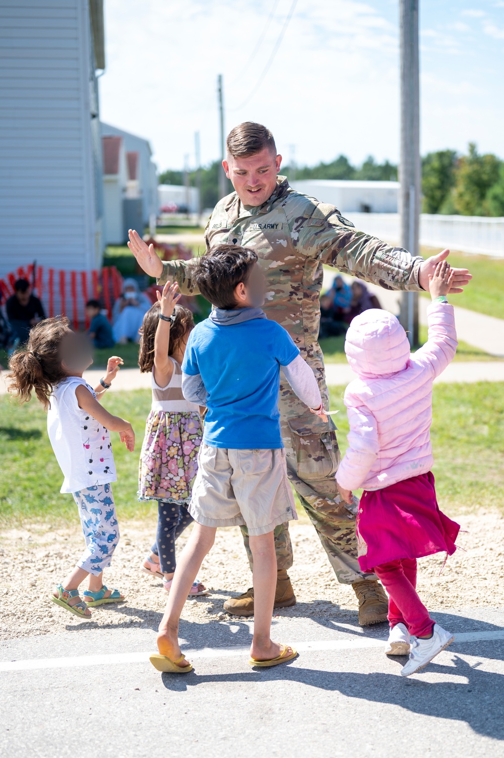 Task Force McCoy Soldier spends time with evacuees