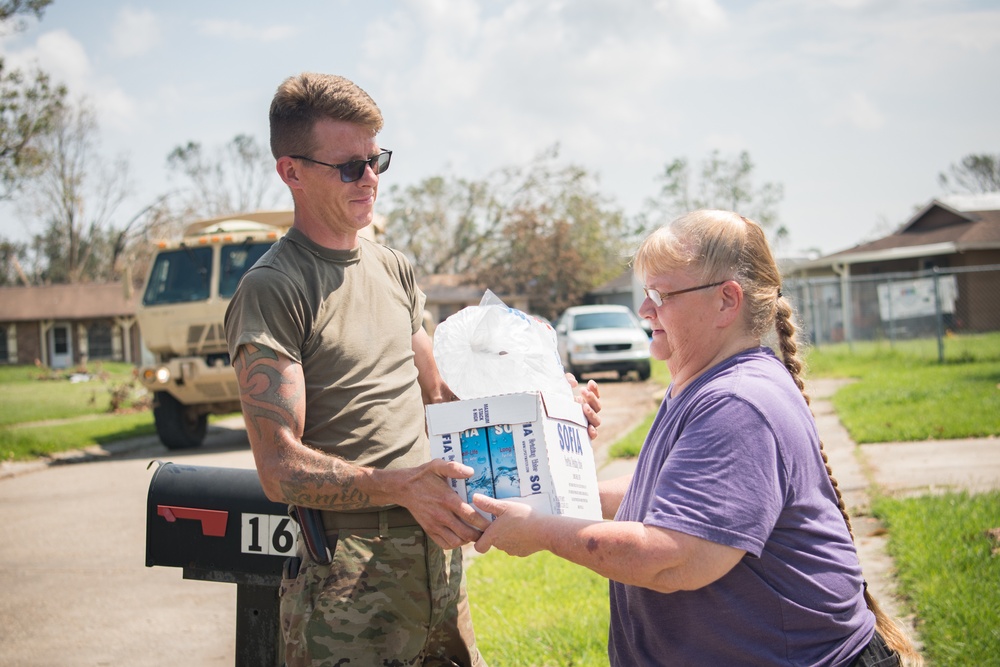 Oklahoma National Guardsmen distribute food, water to Louisiana neighborhoods after Hurricane Ida