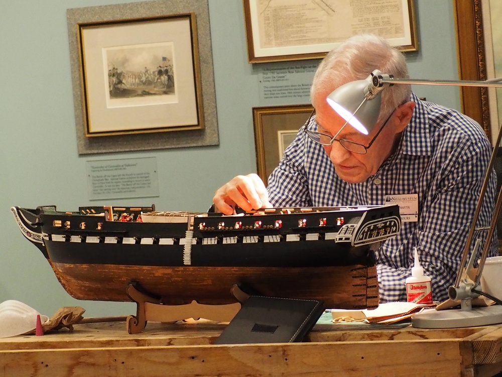 Volunteer model ship builder at Naval Museum