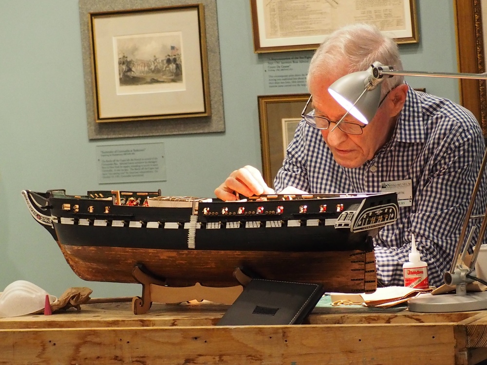 Volunteer model ship builder at Naval Museum