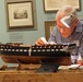 Volunteer model ship builder at Naval Museum