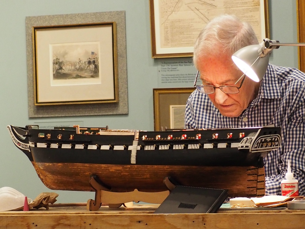 Volunteer model ship builder at Naval Museum