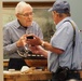 Volunteer model ship builder at Naval Museum