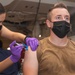 Sailor administers a COVID-19 Vaccine