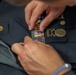 Sgt. Ryan Rudolph adjusts his uniform
