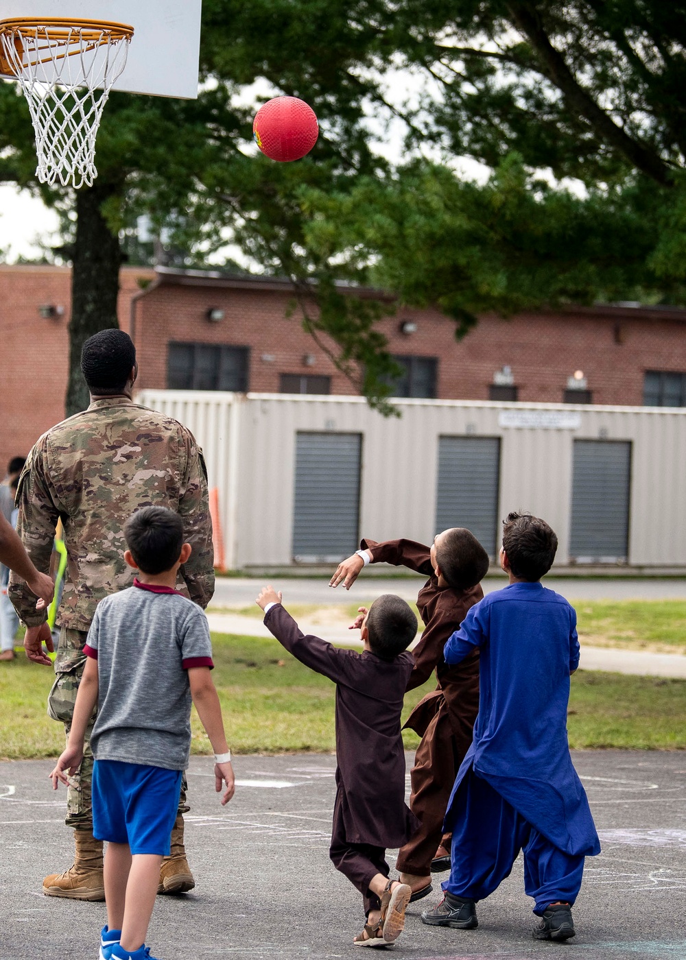 Liberty Village Airmen play basketball with Afghan Children