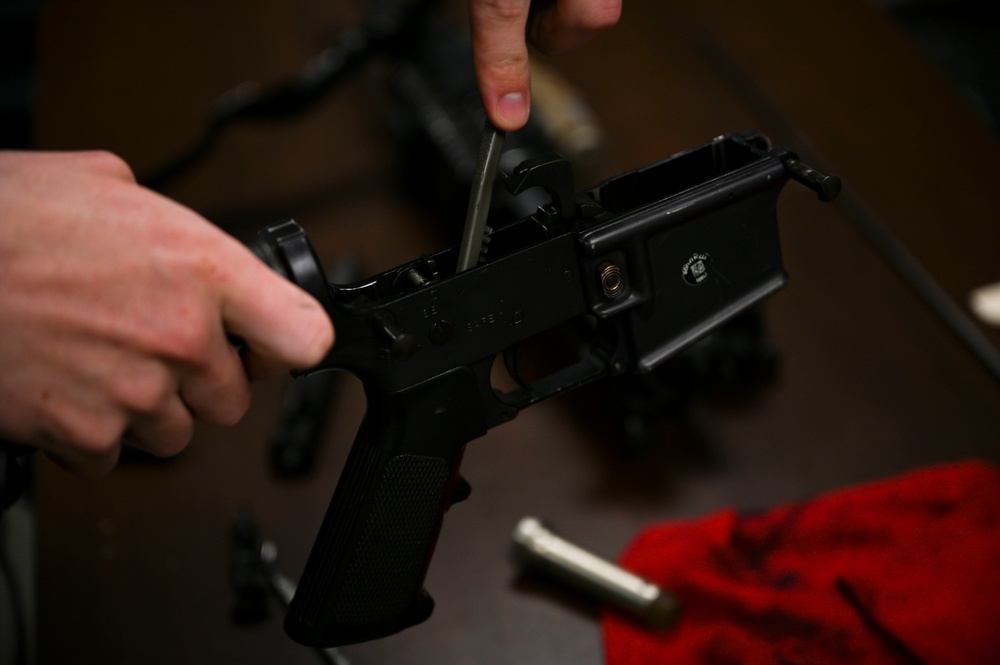 100th Security Forces Squadron Airmen perform routine weapon maintenance at RAF Mildenhall.