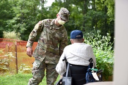 Michigan National Guard members work with veterans at the Michigan Veteran Homes at Grand Rapids