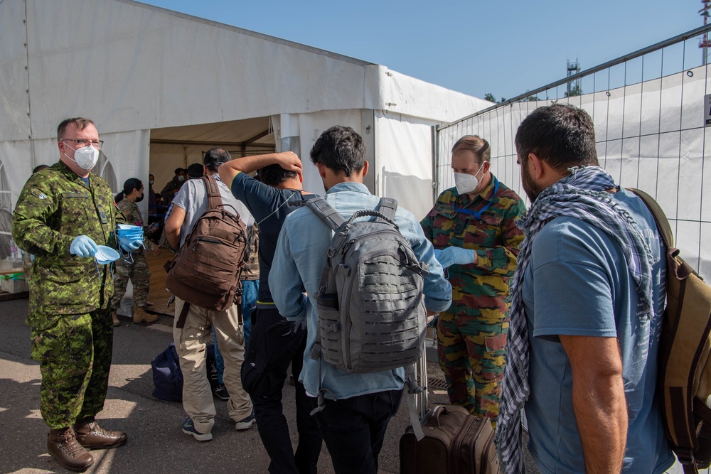 NATO Processes Outbound Afghan Evacuees