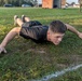 Spc. Alec Waterman performs a hand release push-up