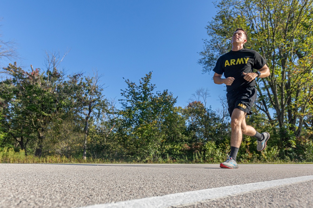 Spc. Nicholas Kyne runs