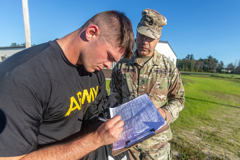 Spc. Alec Waterman signs his Army combat fitness test scorecard