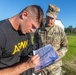 Spc. Alec Waterman signs his Army combat fitness test scorecard