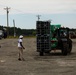 Contract Workers Moves Cases of Chairs into New Facilities for Afghan Personnel at Fort Pickett, Virginia.