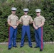 Pfc. Lucas Gravelle is congratulated by other Marine family members