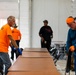 Contract Workers Sets Up Tables and Chairs in New Dining Facility for Afghan Personnel at Fort Pickett, Virginia.