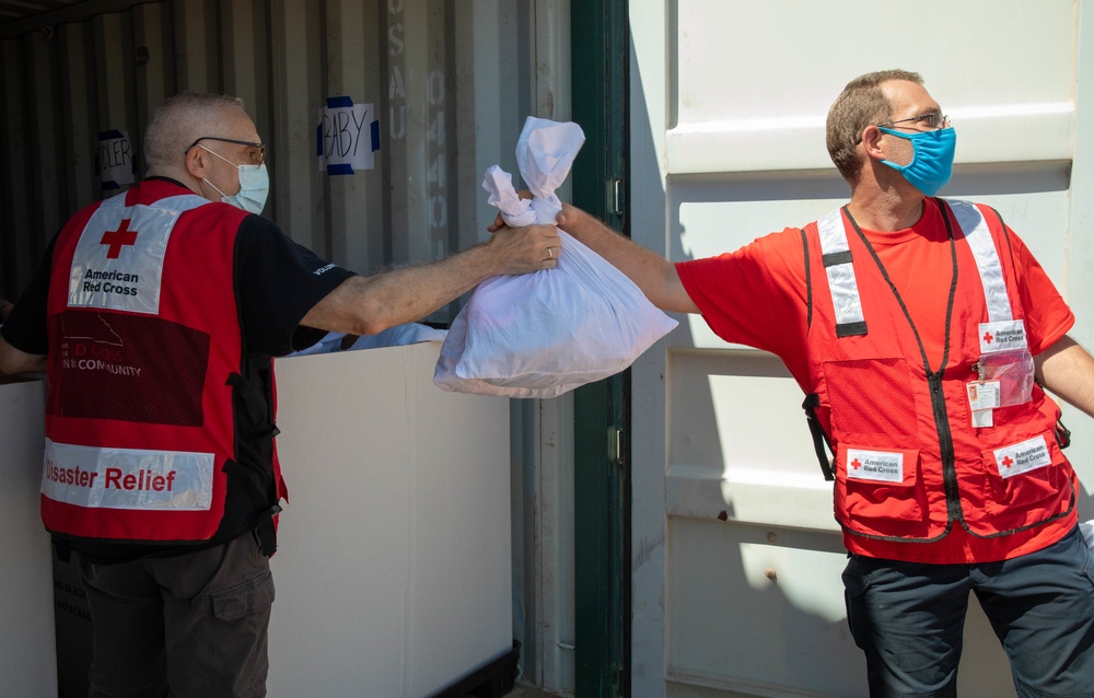 American Red Cross volunteers deliver clothes