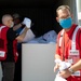 American Red Cross volunteers deliver clothes